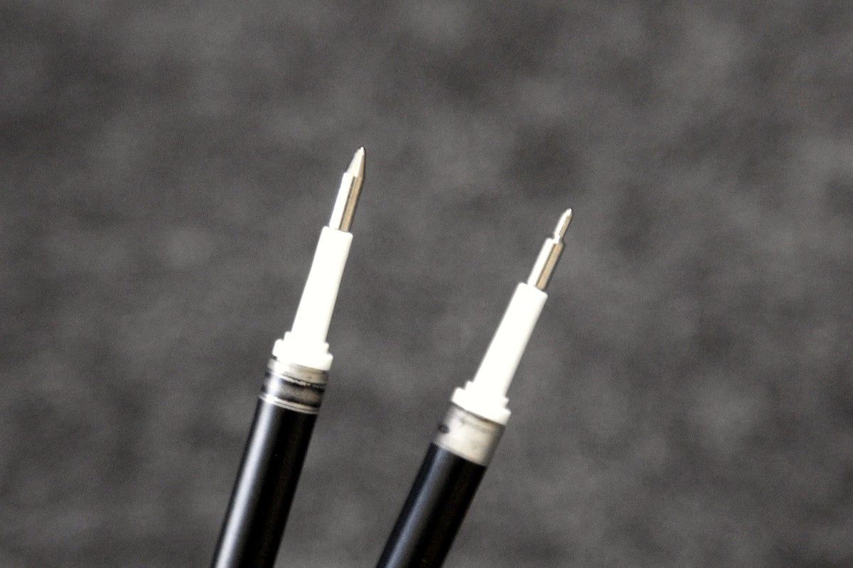 Standard metal and needle tips of 0.70 mm Pentel EnerGel refills shown side by side.