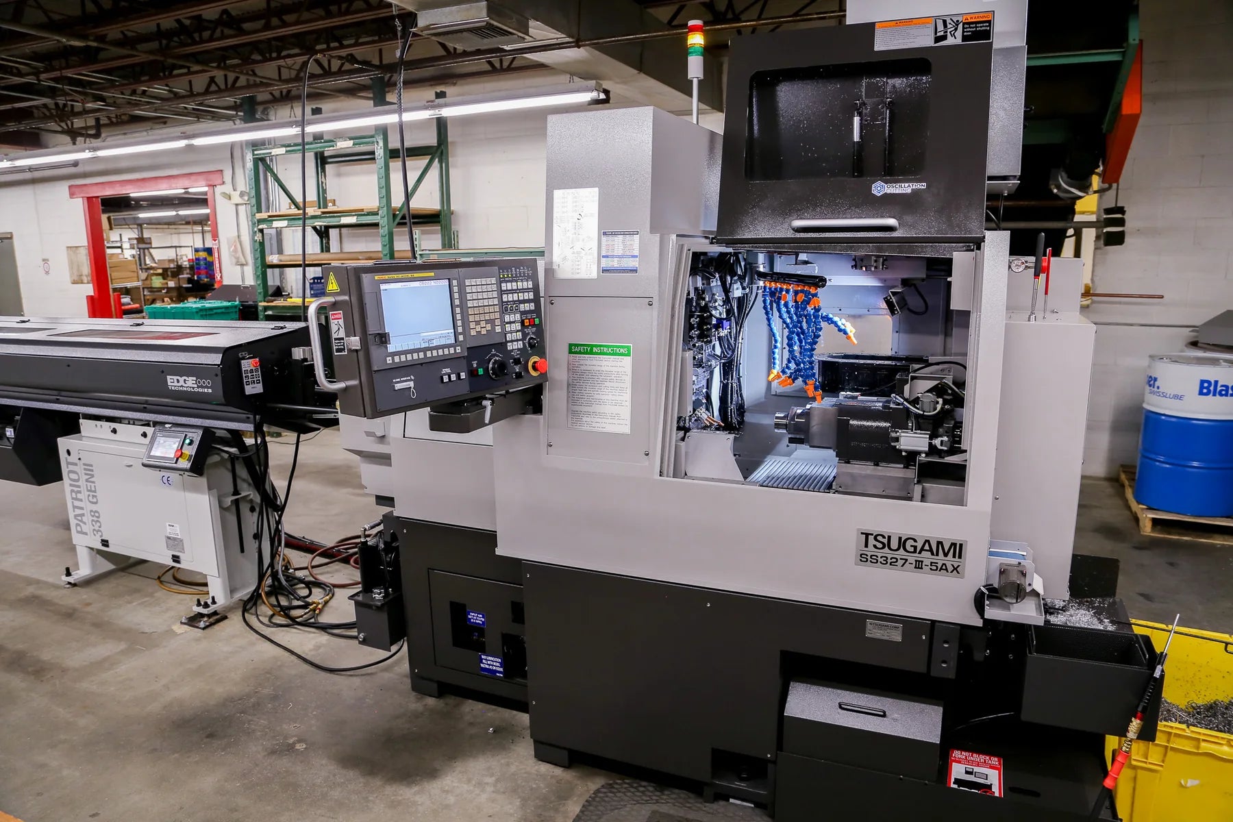 Veridune's Tsugami Swiss CNC lathe and bar feeder in the Rhode Island shop