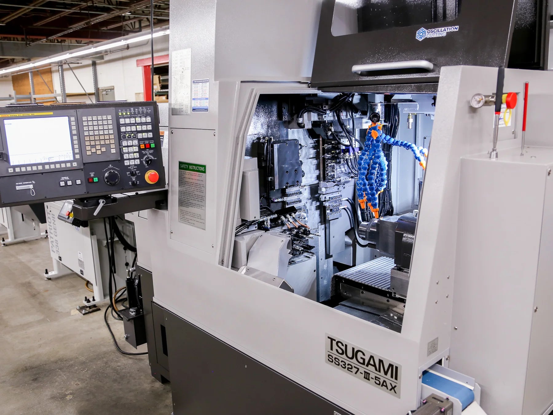 Tsugami SS327 Swiss CNC machine with its work area open